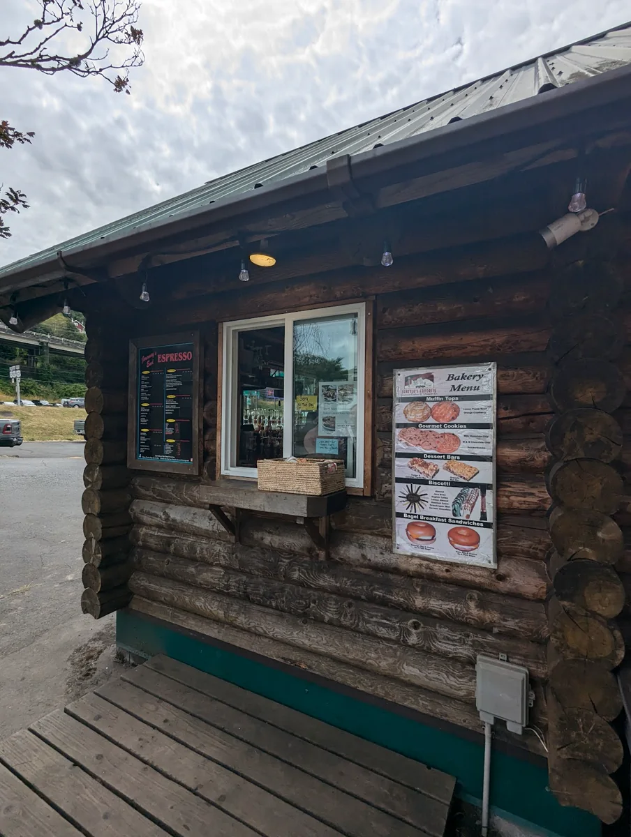 The service window at Journey's End Espresso with espresso and bakery menu boards